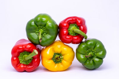 Close-up of bell peppers against white background