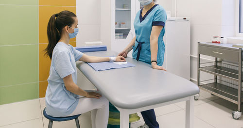 Nurse treating patient in hospital