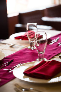 Close-up of drinking glasses on table