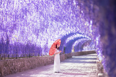 Rear view of woman walking on street