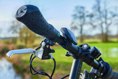 Handlebars of a bicycle in front of the moorland of northern germany, selective focus