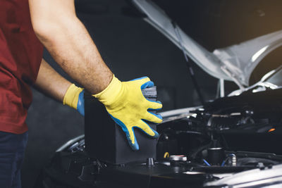 Midsection of man working at bus