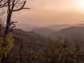 Scenic view of mountains against sky during sunset