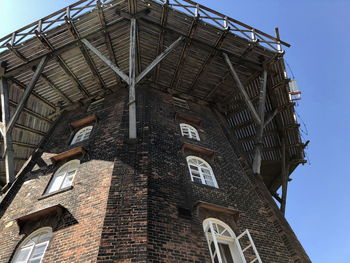 Low angle view of clock tower against sky
