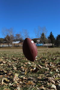 High angle view of basketball ball on field against clear blue sky