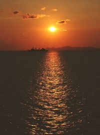 Scenic view of sea against orange sky