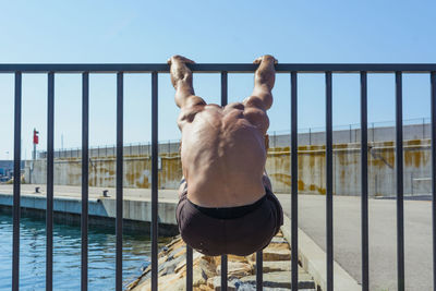 Sportsman practicing stretching and calisthenics