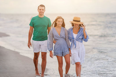 Full length of woman standing at beach