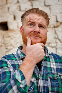 Portrait of young man standing outdoors