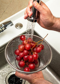 Cropped hand of person preparing food