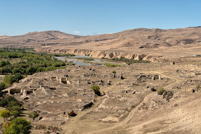 Scenic view of desert against clear sky