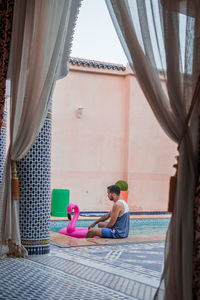 Caucasian man chilling out on the poolside in the hotel