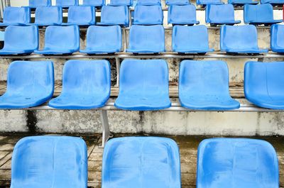 Full frame shot of blue seats in row