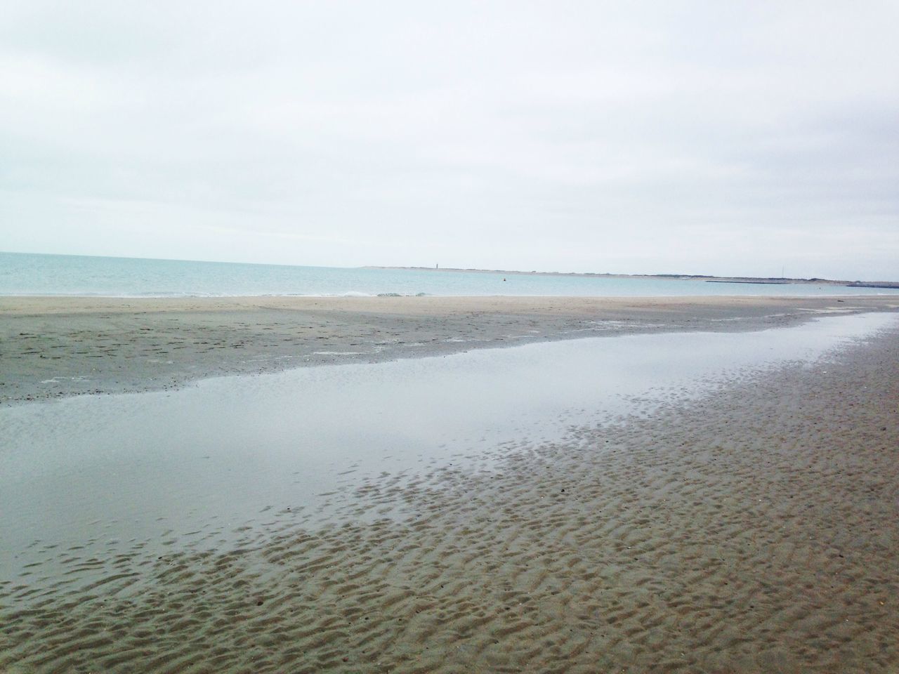 sea, beach, water, horizon over water, sand, shore, tranquil scene, tranquility, sky, scenics, beauty in nature, nature, coastline, wave, idyllic, remote, calm, outdoors, day, surf