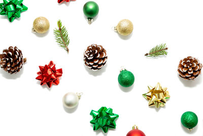 High angle view of christmas decorations over white background