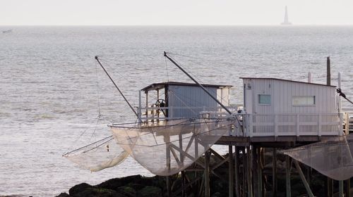 Lifeguard hut on beach against clear sky