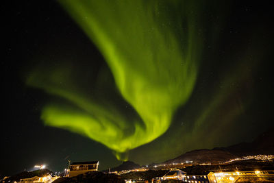 Aerial view of illuminated mountain against sky at night