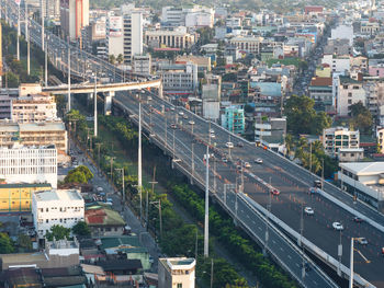 High angle view of railroad tracks amidst buildings in city