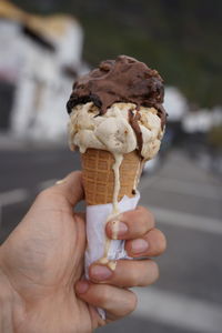 Cropped image of hand holding ice cream