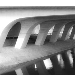 Low angle view of bridge over river against sky