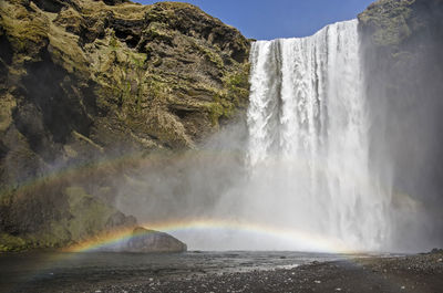 A double rainbow above the river just downstream from the famous skogafoss waterfall in iceland