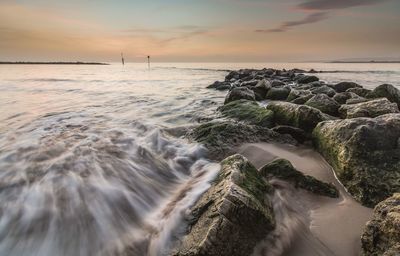 Scenic view of sea at sunset