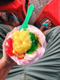 Close-up of hand holding ice cream