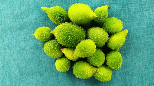 High angle view of fruits against blue background