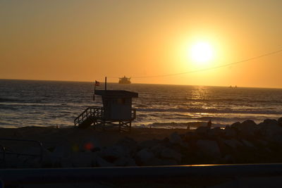 Scenic view of sea against clear sky during sunset