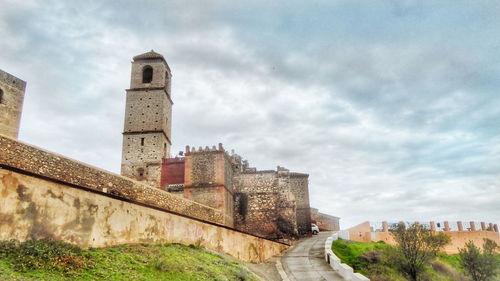 Historic building against cloudy sky