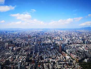 Aerial view of cityscape against sky