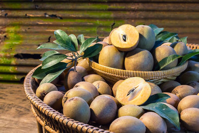 Sapodilla fruit in a wicker basket