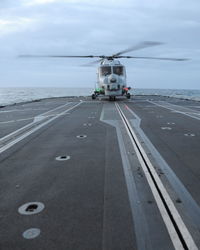 High angle view of road by sea against sky