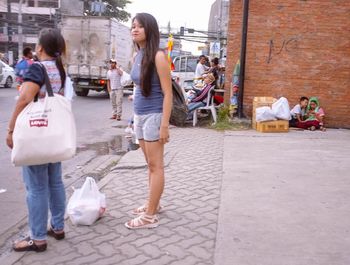 Woman standing on street