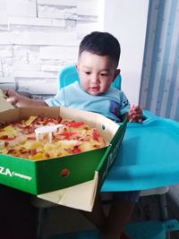 Portrait of boy holding food