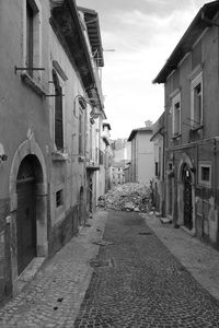 Street amidst buildings against sky