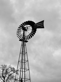 Low angle view of windmill against sky