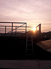 Silhouette of bridge against sky during sunset