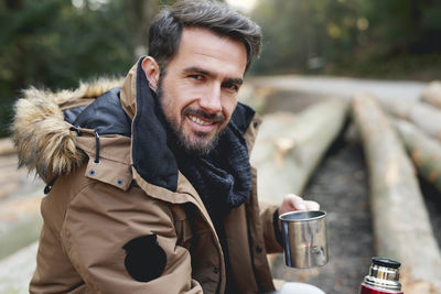 Portrait of smiling young man in winter