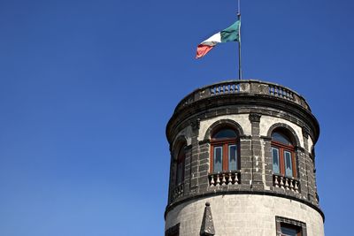 Low angle view of flag against sky