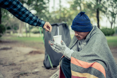 Man holding coffee cup