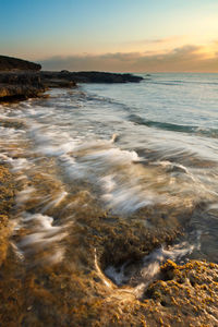 Scenic view of sea against sky during sunset