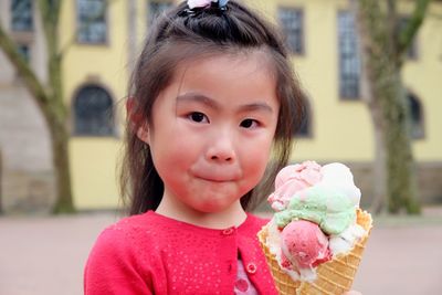 Portrait of cute girl holding ice cream