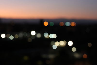 Defocused image of illuminated lights at night