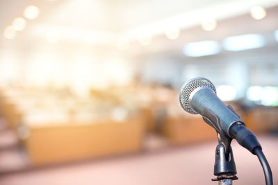 Close-up of microphone in auditorium