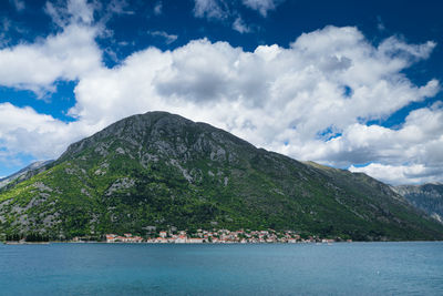 Scenic view of mountains against cloudy sky