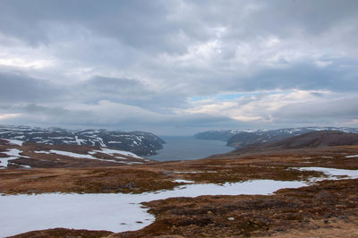 Scenic view of snowcapped mountains against sky