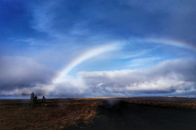 Scenic view of landscape against cloudy sky