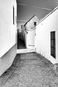 Alley amidst buildings in city