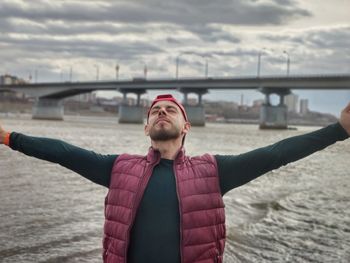 Low angle view of man standing against sky